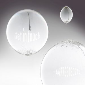Three bleach bubbles floating with the words 'get in Touch' and a telephone number inside two of them